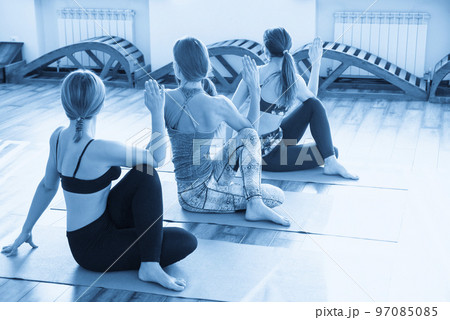 Yoga Class, Group of People sitting and Doing Yoga pose. Healthy Lifestyle. 97085085