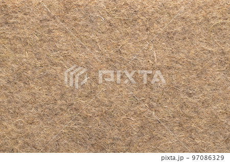 Hemp mat, surface and background, from above. Growth medium for growing microgreens. Industrial and natural hemp fibres, intertwined into a biodegradable and compostable alternative to growing soil. Hemp mat, surface and background, from above. Growth medium for growing microgreens. Industrial and natural hemp fibres, intertwined into a biodegradable and compostable alternative to growing soil. 97086329