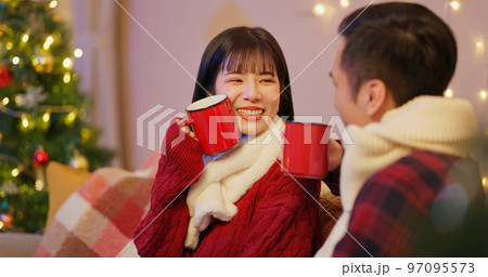 couple sitting together on xmas couple sitting together on xmas 97095573