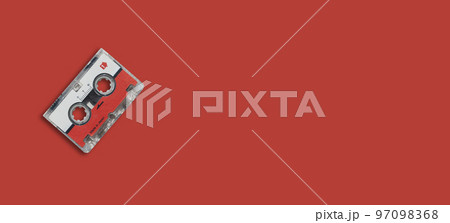 Mini cassette tape on colored background. 97098368