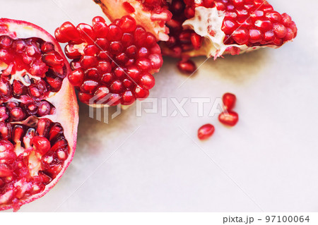 pomegranate seeds close-up. pomegranate on a light background 97100064