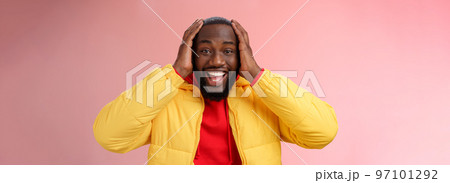 Happy surprised pleased young african-american 25s man young jacket red hoodie smiling amused, astonished smiling receiving awesome gift holding hands head thrilled, standing pink background Happy surprised pleased young african-american 25s man young jacket red hoodie smiling amused, astonished smiling receiving awesome gift holding hands head thrilled, standing pink background 97101292