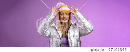 Amazed attractive fascinated young female traveler take off sunglasses check-out stunning perfect view snowy mountains smiling like child impressed satisfied perfect honeymoon trip winter 97101346