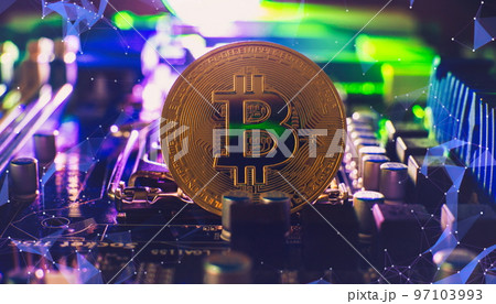 Cryptocurrency concept , Golden bitcoin on winners cup background mainboard , The future of money. Computational equipment. 97103993