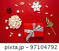 Christmas or winter composition. Cup with coffee, marshmallows, gift and Christmas decor. Flat lay, top view 97104792