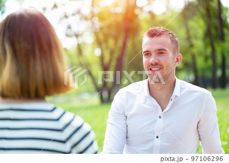Couple with a dog in the park 97106296