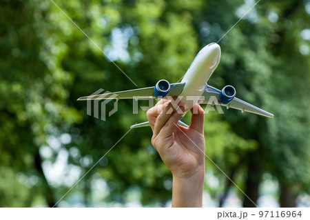 Boy holding a toy plane Boy holding a toy plane 97116964