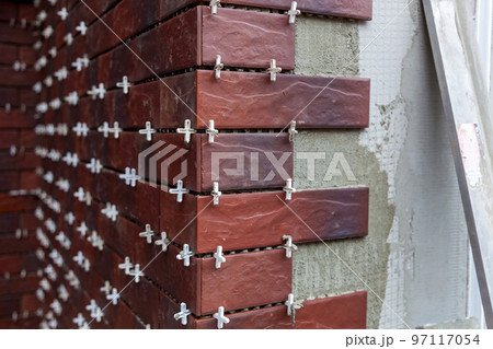 installation of facing facade tiles installation of facing facade tiles 97117054