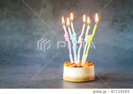 Birthday cake cupcake with colorful burning candles 97119265