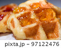 Close up fresh waffles topped with above pineapple jam 97122476
