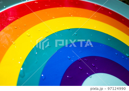 Multicolored rainbow with water drops after rain abstract background. LGBT, LGBTQ symbol. World Pride Month in June. Tolerant attitude towards sexual minorities, protection of human rights concept. Multicolored rainbow with water drops after rain abstract background. LGBT, LGBTQ symbol. World Pride Month in June. Tolerant attitude towards sexual minorities, protection of human rights concept. 97124990