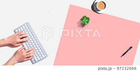 Woman using a computer keyboard Woman using a computer keyboard 97132666