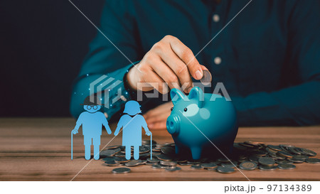Man putting coin into piggy bank for saving money, retirement, health care, business finance and investment. Man putting coin into piggy bank for saving money, retirement, health care, business finance and investment. 97134389