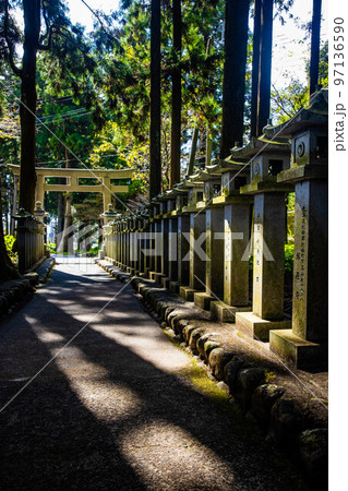 Japanese stone toro lanterns at shrine entrance Japanese stone toro lanterns at shrine entrance 97136590