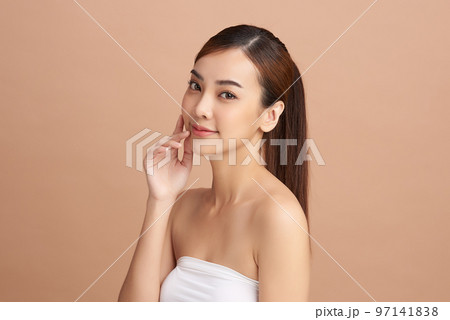 Beautiful young asian woman with clean fresh skin on beige background, Face care, Facial treatment, Cosmetology, beauty and spa, Asian women portrait. 97141838