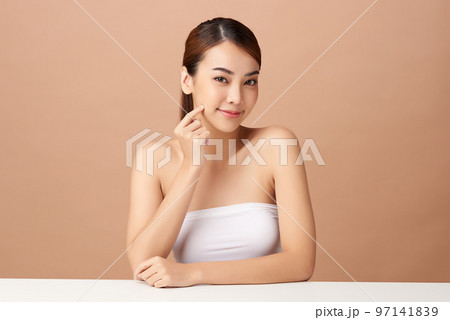 Beautiful young asian woman with clean fresh skin on beige background, Face care, Facial treatment, Cosmetology, beauty and spa, Asian women portrait. 97141839