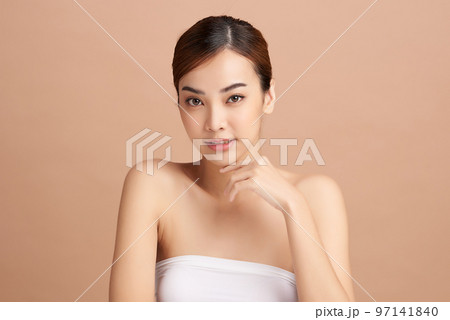 Beautiful young asian woman with clean fresh skin on beige background, Face care, Facial treatment, Cosmetology, beauty and spa, Asian women portrait. Beautiful young asian woman with clean fresh skin on beige background, Face care, Facial treatment, Cosmetology, beauty and spa, Asian women portrait. 97141840