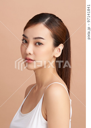 Beautiful young asian woman with clean fresh skin on beige background, Face care, Facial treatment, Cosmetology, beauty and spa, Asian women portrait. 97141841