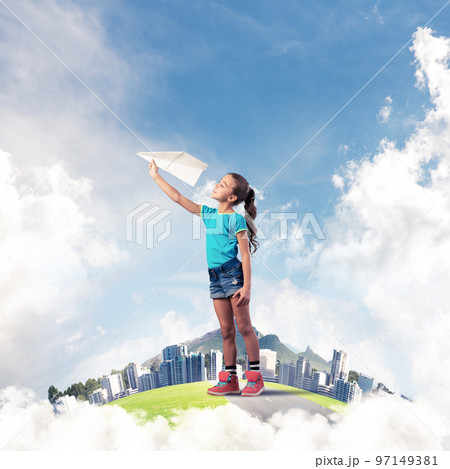 Concept of careless happy childhood with girl dreaming about future 97149381