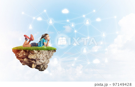 Concept of careless happy childhood with girl dreaming about something Concept of careless happy childhood with girl dreaming about something 97149428