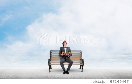 Young student with a book 97149447
