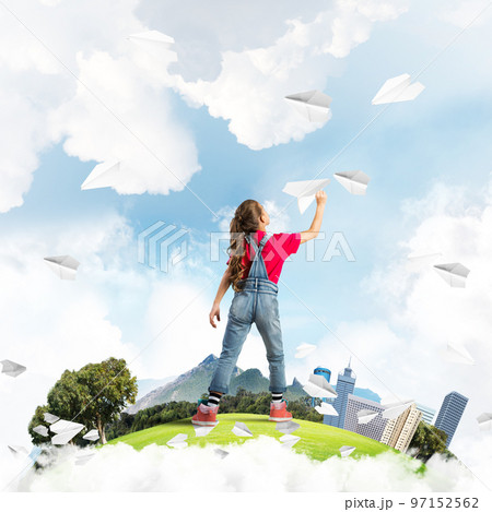 Concept of careless happy childhood with girl dreaming about future 97152562