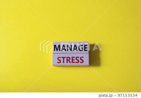 Manage stress symbol. Concept word Manage stress on wooden blocks. Beautiful yellow background. Business and Manage stress concept. Copy space Manage stress symbol. Concept word Manage stress on wooden blocks. Beautiful yellow background. Business and Manage stress concept. Copy space 97153534