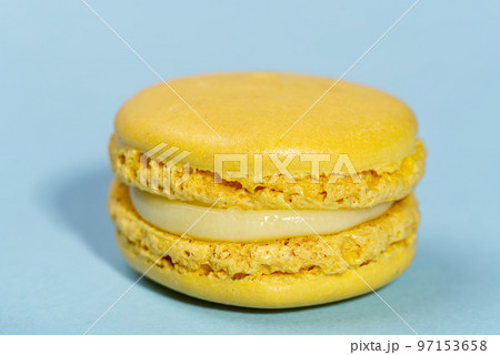 Macaron. Traditional french colorful macarons close up, macro on blue background 97153658