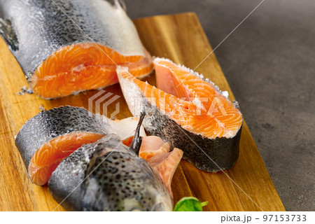 Cutting salmon fresh fish for dinner. diy cooking at home Cutting salmon fresh fish for dinner. diy cooking at home 97153733
