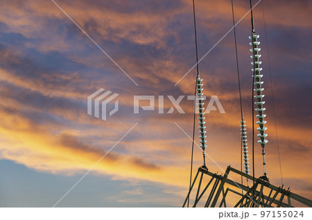 Electricity pylon (high voltage power line) against the background of a romantic evening sky Electricity pylon (high voltage power line) against the background of a romantic evening sky 97155024