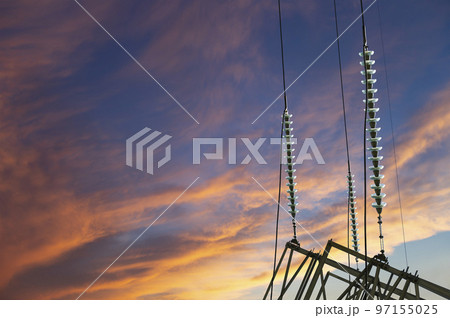 Electricity pylon (high voltage power line) against the background of a romantic evening sky Electricity pylon (high voltage power line) against the background of a romantic evening sky 97155025