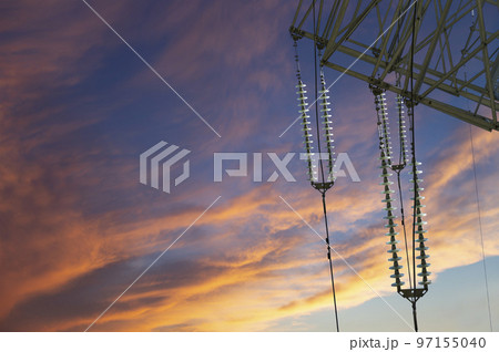 Electricity pylon (high voltage power line) against the background of a romantic evening sky Electricity pylon (high voltage power line) against the background of a romantic evening sky 97155040