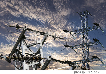 Electricity pylon (high voltage power line) against the background of a romantic evening sky Electricity pylon (high voltage power line) against the background of a romantic evening sky 97155206
