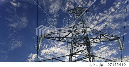 Electricity pylon (high voltage power line) on the background of the cloudy sky 97155410