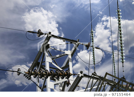 Electricity pylon (high voltage power line) on the background of the cloudy sky 97155464
