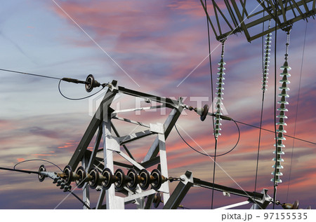 Electricity pylon (high voltage power line) against the background of a romantic evening sky Electricity pylon (high voltage power line) against the background of a romantic evening sky 97155535