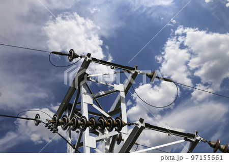 Electricity pylon (high voltage power line) on the background of the cloudy sky Electricity pylon (high voltage power line) on the background of the cloudy sky 97155661