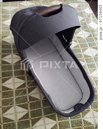 a bassinet from a stroller in a separate room 97156405