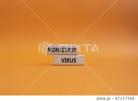 Monkeypox virus symbol. Concept word Monkeypox virus on wooden blocks. Beautiful orange background. Medicine and Monkeypox virus concept. Copy space 97157560
