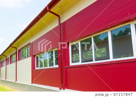 Red gutter on the roof top of house. Red gutter on the roof top of house. 97157847