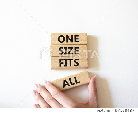 One size fits all symbol. Concept words One size fits all on wooden blocks. Beautiful white background. Businessman hand. Business and One size fits all concept. Copy space. One size fits all symbol. Concept words One size fits all on wooden blocks. Beautiful white background. Businessman hand. Business and One size fits all concept. Copy space. 97158437