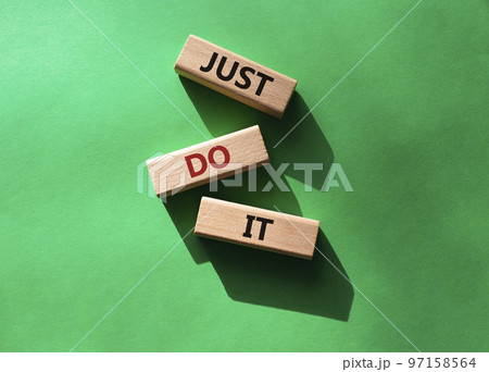 Just do it symbol. Wooden blocks with words Just do it. Beautiful green background. Business and Just do it concept. Copy space. Just do it symbol. Wooden blocks with words Just do it. Beautiful green background. Business and Just do it concept. Copy space. 97158564