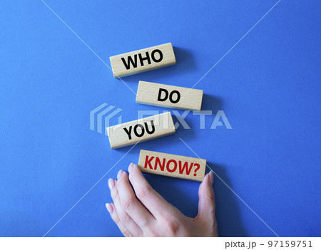 Who do you know symbol. Concept words Who do you know on wooden blocks. Beautiful blue background. Businessman hand. Business and Who do you know concept. Copy space Who do you know symbol. Concept words Who do you know on wooden blocks. Beautiful blue background. Businessman hand. Business and Who do you know concept. Copy space 97159751