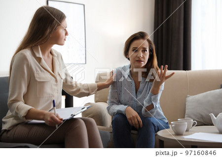 Professional psychotherapist working with patient in office 97160846