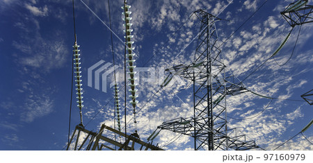 Electricity pylon (high voltage power line) on the background of the cloudy sky 97160979