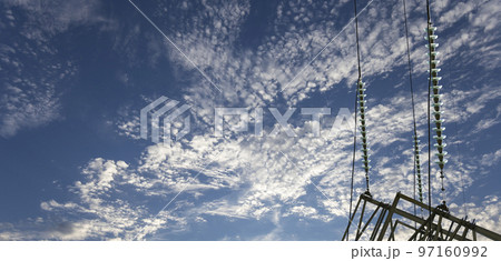 Electricity pylon (high voltage power line) on the background of the cloudy sky 97160992