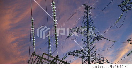 Electricity pylon (high voltage power line) against the background of a romantic evening sky Electricity pylon (high voltage power line) against the background of a romantic evening sky 97161179