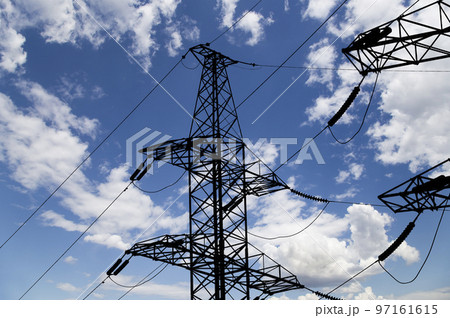 Electricity pylon (high voltage power line), black contour,  on the background of the cloudy sky 97161615