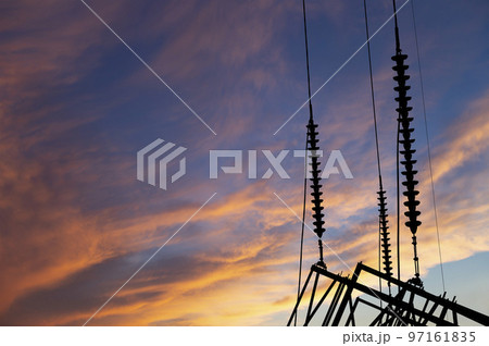 Electricity pylon (high voltage power line), black contour, against the background of a romantic evening sky Electricity pylon (high voltage power line), black contour, against the background of a romantic evening sky 97161835