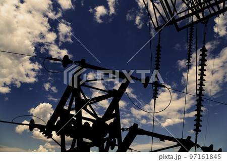 Electricity pylon (high voltage power line), black contour, against the background of a romantic evening sky Electricity pylon (high voltage power line), black contour, against the background of a romantic evening sky 97161845